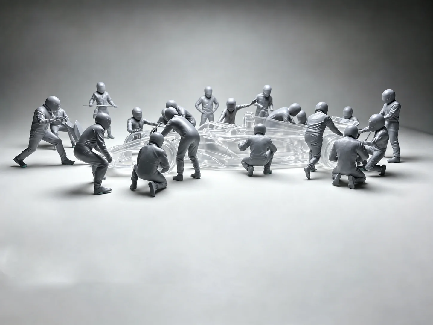 Unpainted grey resin racing crew models, sculpted in miniature